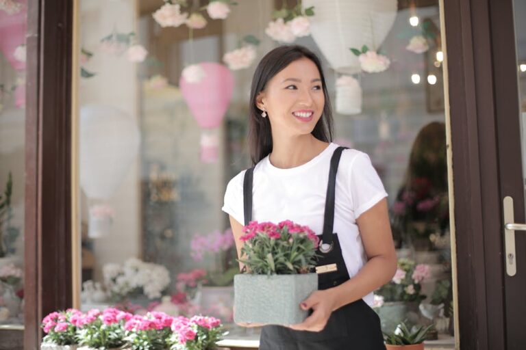 All about personal values examples: A woman holding a flowerpot.