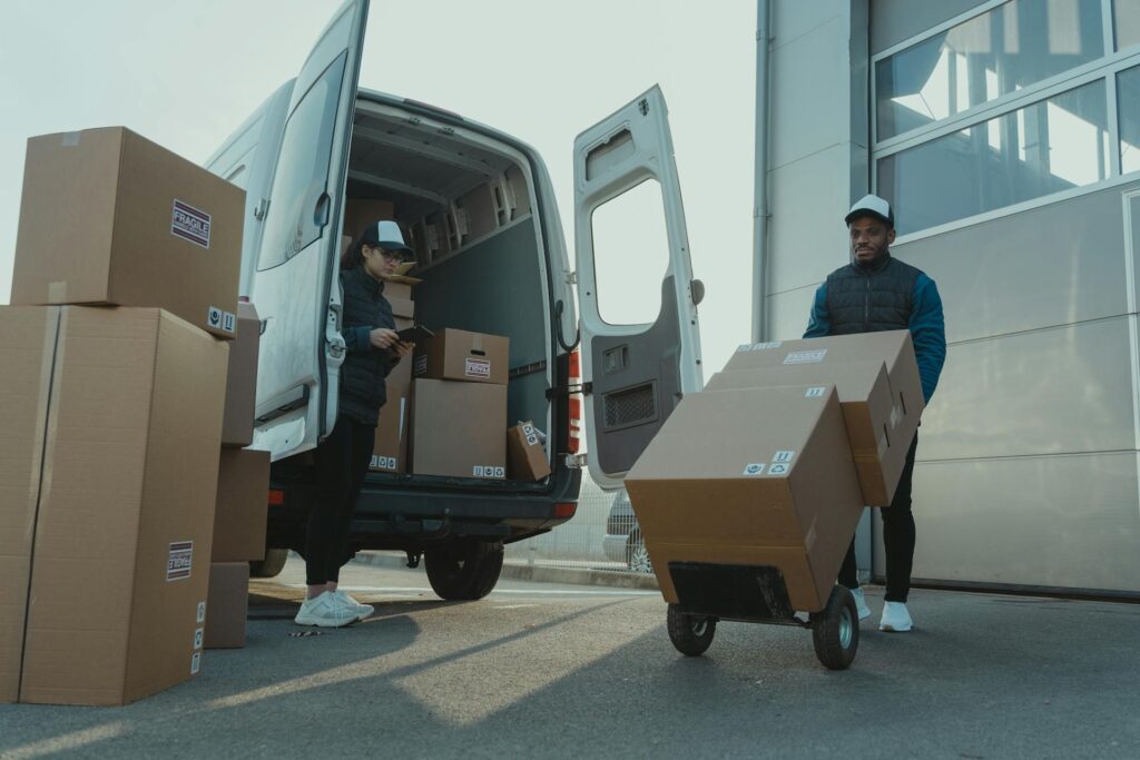 Richmond courier service employee packing items to deliver to customers.